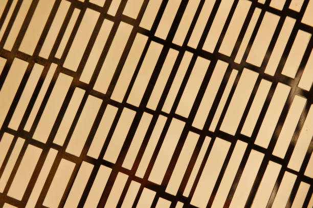 istock Close-up photo of yellow stained glass window with irregular rectangular pattern. Abstract architecture detail. Textured glass background. 1097252564