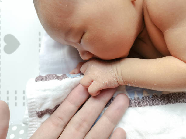 istock New born cute baby sleep on the bed 1097252780