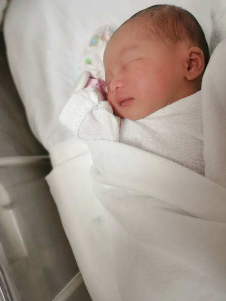 istock New born cute baby sleep on the bed 1097252782