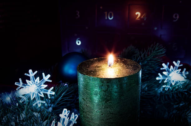 istock Advent wreath with candles with snow as background and advent calendar 1097254390