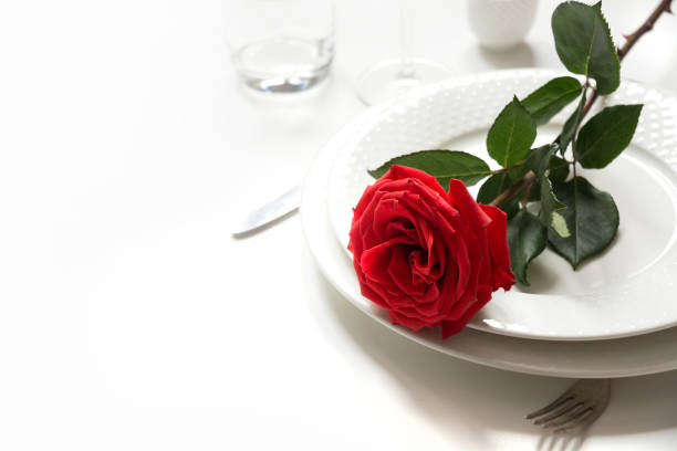 istock Valentine's day or birthday romantic dinner. Romantic table setting with red rose. 1097254924