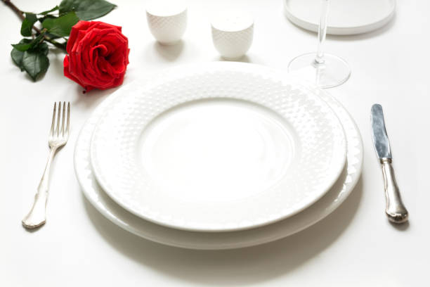 istock Valentine's day or birthday romantic dinner. Romantic table setting with red rose. 1097254930