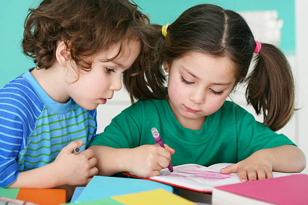 istock Little Boy and Girl Coloring 109725752