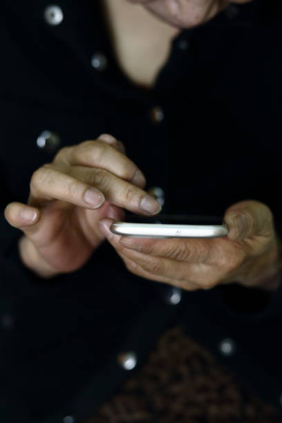 istock A middle-aged woman uses a smart phone. 1097257854