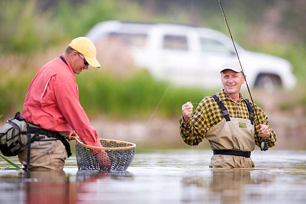 pobocze fly połowów - fishing rod fishing fishing reel casting zdjęcia i obrazy z banku zdjęć