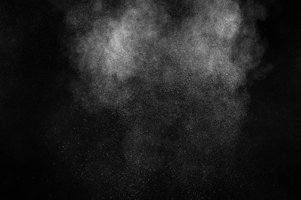 istock Freeze motion of white particles on black background. 1097258732