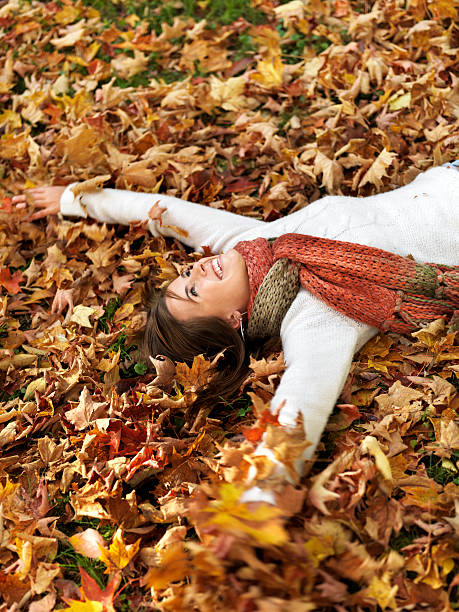 istock Woman laying in autumn leafs 109725948