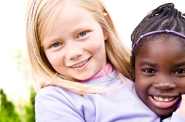 istock Two Happy Girls Smiling and Hugging Each Other 109726293