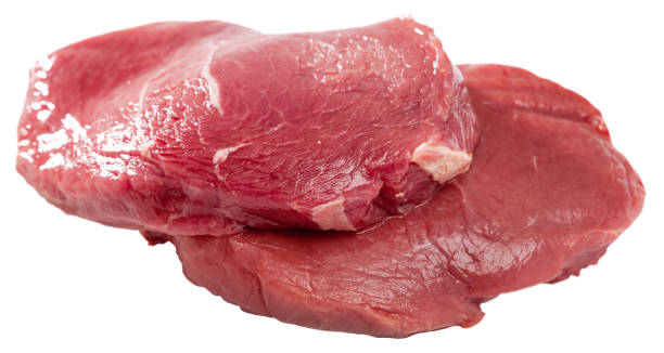 istock Fresh slices of raw beef isolated  on clear white background 1097263618