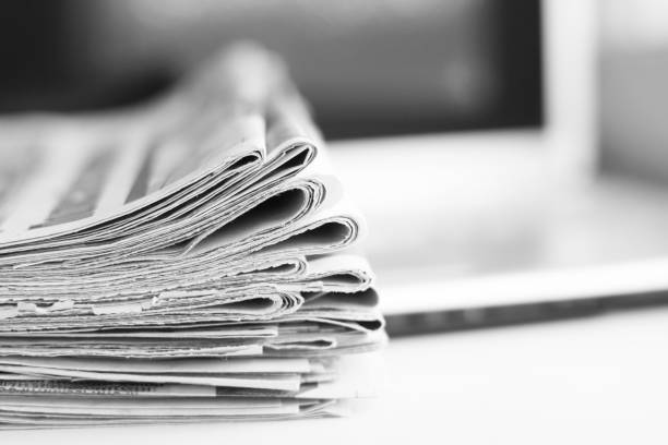 istock Newspapers and Laptop 1097264072