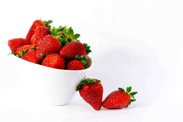 istock strawberry on white bowl with white background 1097264218