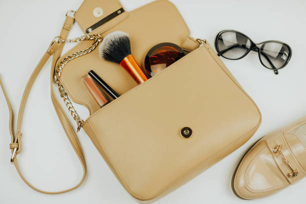 istock handbag with cosmetics. sunglasses. shoe. White background. 1097264512