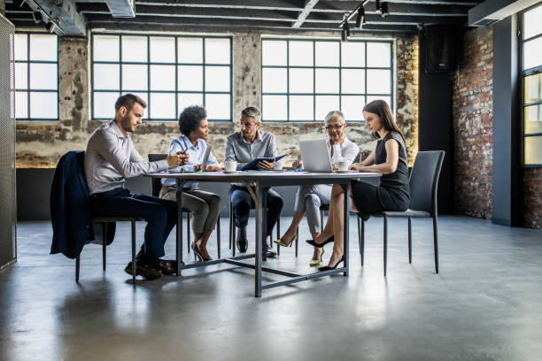 istock Multi-tasking business people working on a meeting in the office. 1097264976
