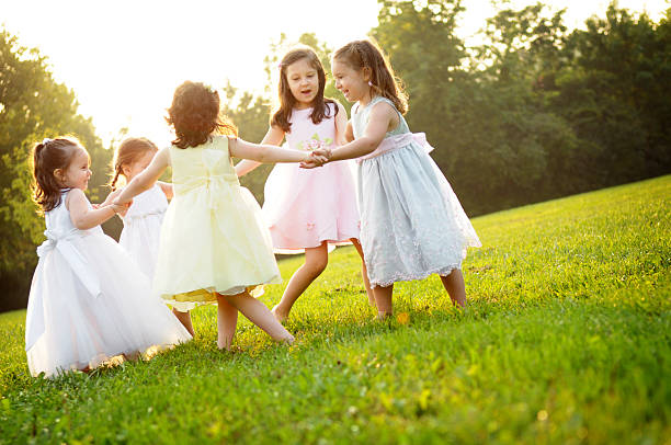 istock Five Little Girls Holding Hands and Spinning in a Circle 109726554