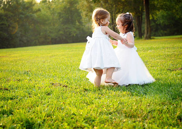 istock Two Little Princesses Dancing in the Grass 109726555