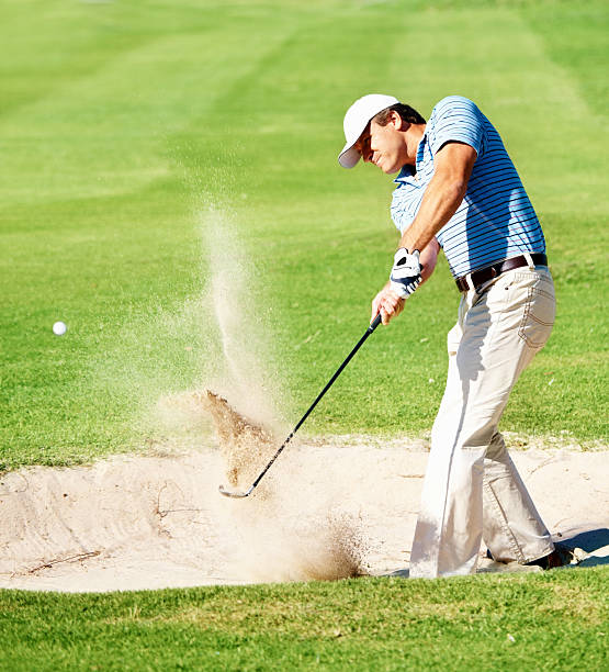 istock Mature golfer chipping the ball from sand trap 109726559