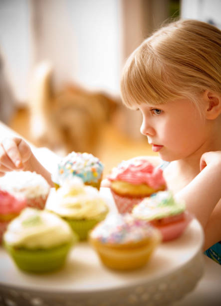 Child with Cupcakes stock photo