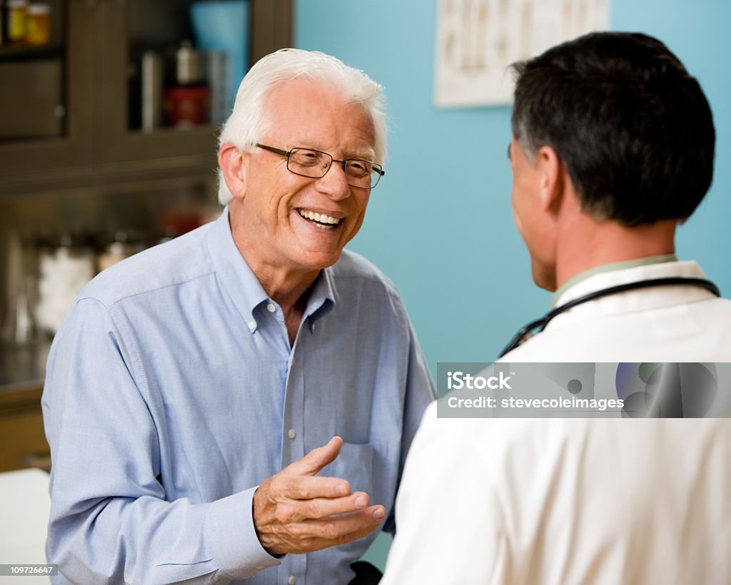 Doctor and Patient Consulting  Adult Stock Photo