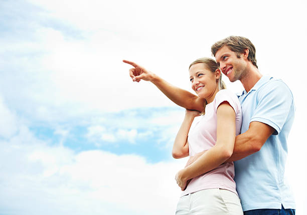 Young woman and man posing to camera