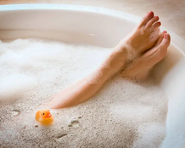 Woman in bathtub. Bubble Bath. Horizontal shot.