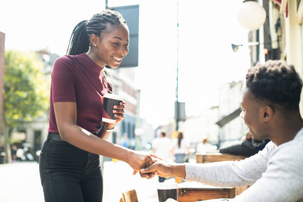 African couple shaking hands together African couple shaking hands together romantic activity stock pictures, royalty-free photos & images