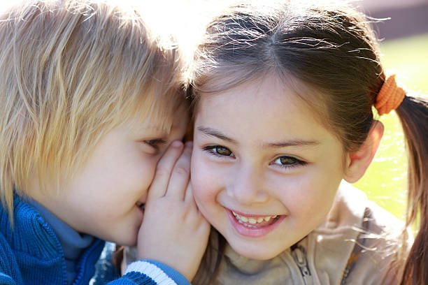 istock Little Boy Telling Girl Secret 109726847