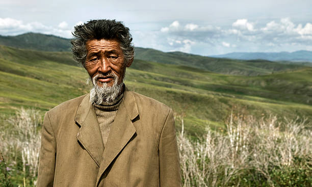 porträt von mongolische mann im feld - rawpixel stock-fotos und bilder