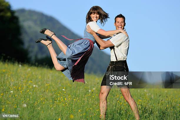 Summer Love Beautiful Couple In Lederhosen And Dirndl Stock Photo - Download Image Now