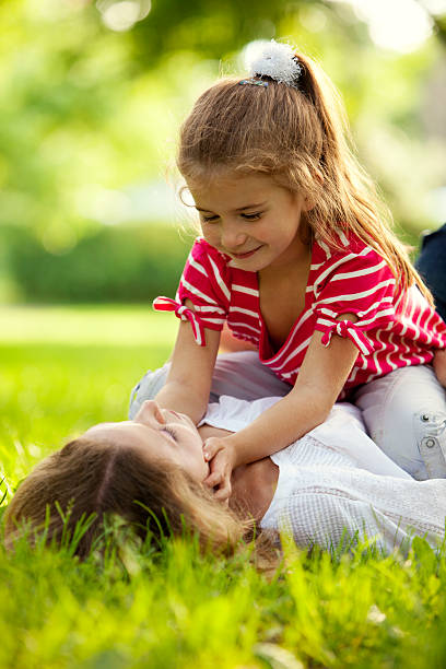 istock Mother and daughter having fun in autumn park 109727029