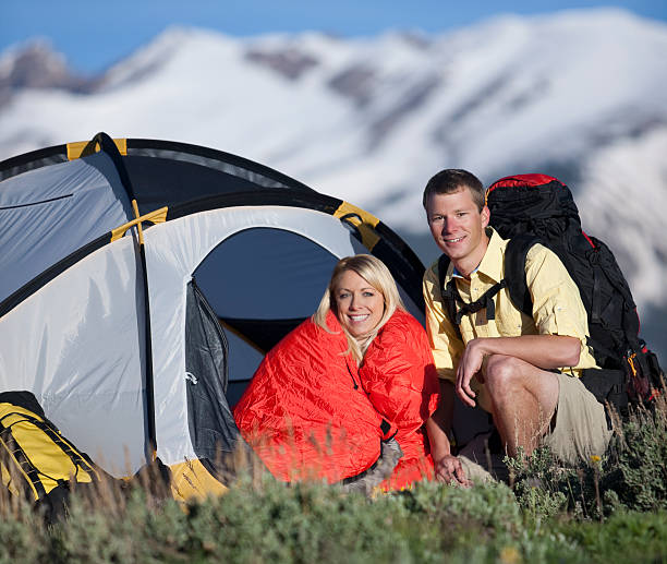 istock Young Couple Camping In Mountains With Tent And Backpack 109727079