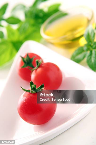 Tomatoes And Basil With Olive Oil Stock Photo - Download Image Now - Basil, Cherry Tomato, Color Image