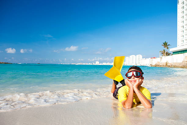istock Vacation Lifestyles-Snorkeling Boy on Beach 109727398