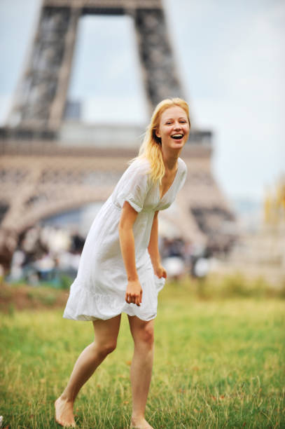 istock Young Woman Tourist Laughing at Eiffel Tower Paris France 109727400