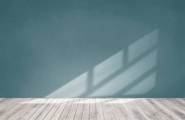 istock Green wall in an empty room with a wooden floor 1097274466