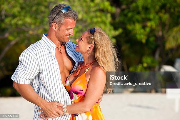 Vacation Lifestylesloving Couple On The Beach At Sunset Stock Photo - Download Image Now