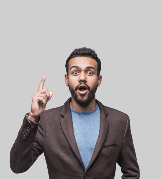 istock Portrait of surprised young man having idea 1097276020