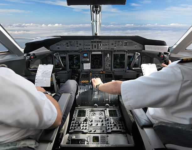 Pilots in the Cockpit - Preparing for Landing stock photo