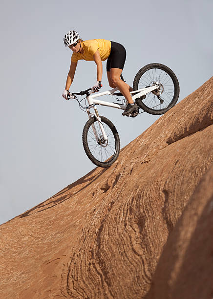 istock Mountain Biking Down Extreme Incline On Slickrock Trail 109727627