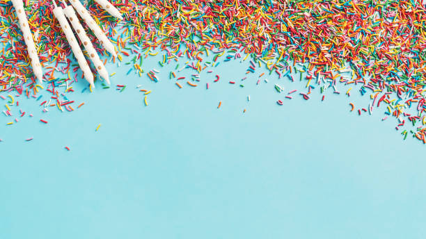 istock Birthday and party concept background with confetti and candles on blue 1097279032