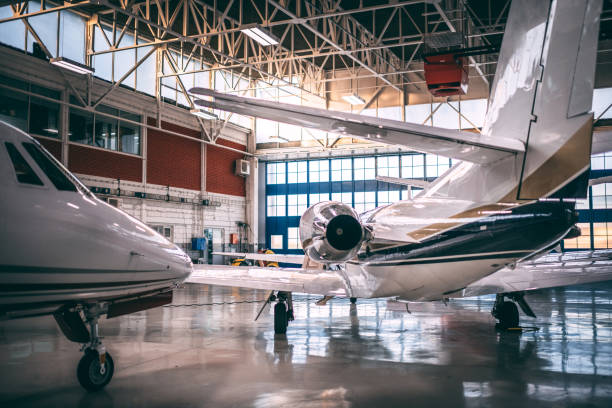 istock Small airplanes parked in a hangar 1097279674