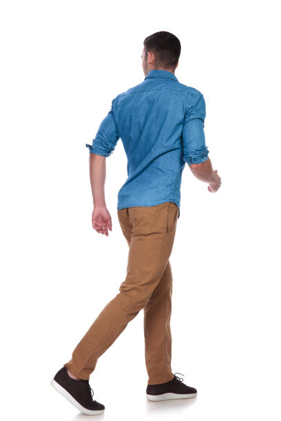 istock handsome casual man steps to side and looks behind 1097279866