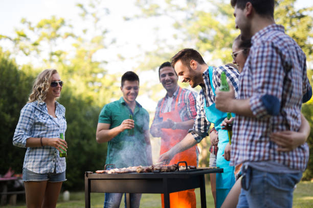 istock Friends enjoying bbq party and smiling in forest 1097282632