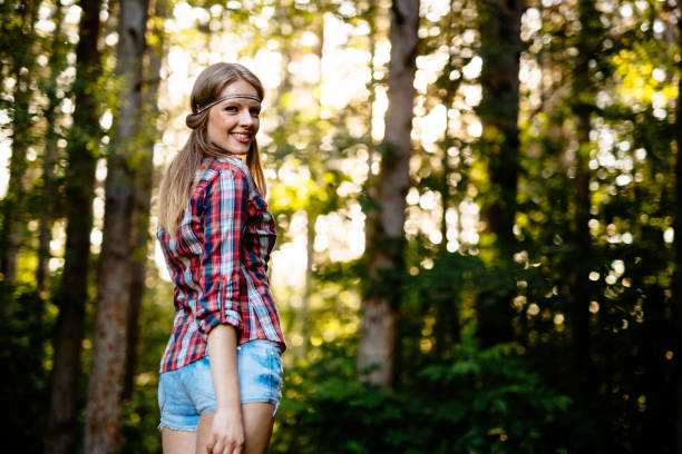 istock Smiling young and beautiful woman in forest 1097282742