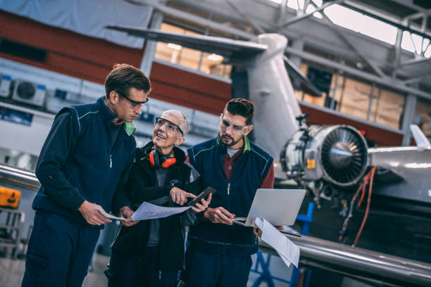 istock Aircraft engineer crew coordinating together in an aircraft hangar 1097284924