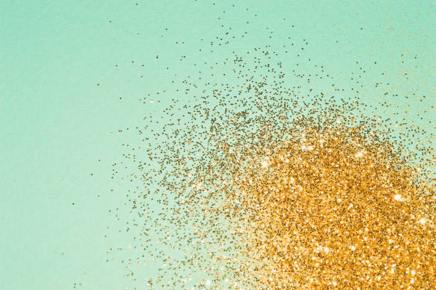 istock Gold glitter on blue background in vintage colors 1097296472