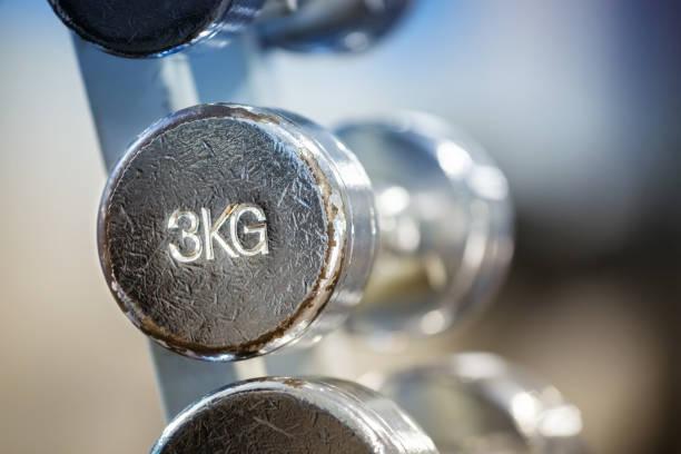 istock Old chrome 3kg dumbbell in a rack. 1097297140