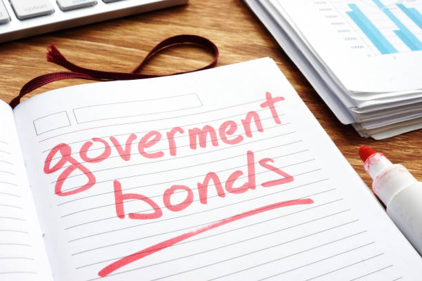 istock Government bonds. Notepad and papers on a desk. 1097298734
