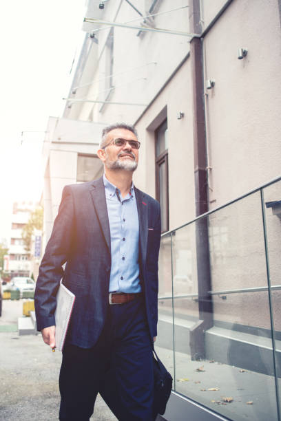 istock Businessman walking in the city 1097298880