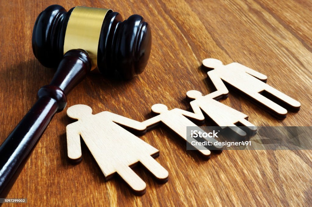 Family law concept. Wooden figures and gavel. Family Stock Photo