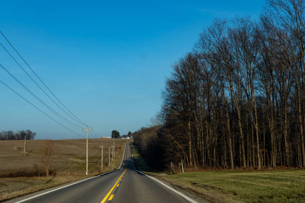istock two-lane road through rural Ohio 1097299140